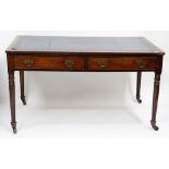 A LATE GEORGIAN MAHOGANY WRITING DESK with a blue leather inset top, two frieze drawers, turned legs