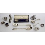 A SELECTION OF SILVER PIERCED TABLE CONDIMENTS tea strainer, ladle, spoons, toast rack, salad