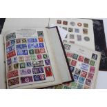 A SELECTION OF GB AND WORLD POSTAGE STAMPS in albums and a selection of loose GB postage stamps (4)
