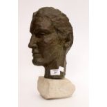 A BRONZED HEAD SCULPTURE on a stone base, 36cm in height