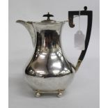 A SHEFFIELD SILVER COFFEE POT standing on bun feet with ebonised trophy handle 22cm high