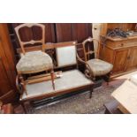 AN EDWARDIAN MAHOGANY AND SATINWOOD INLAID SETTEE with a pierced back and scrolling arms, 98cm