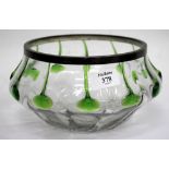 A DECORATIVE POSSIBLY CONTINENTAL GLASS BOWL with applied trailing green prunts and polished out