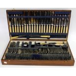 AN OAK CASED CANTEEN OF SILVER PLATED CUTLERY