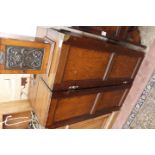 A LATE 19TH CENTURY CAMPAIGN BOOKCASE in three sections, folding into a chest, having a leather