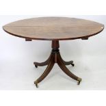 A REGENCY ROSEWOOD OVAL DINING TABLE, 71cm high