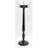 A REGENCY STYLE REVOLVING HAT AND COAT STAND with reeded column on circular spreading base, 149cm