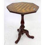 A VICTORIAN WALNUT TILT TOP GAMES TABLE with inlaid decoration on tripod base, 75cm high