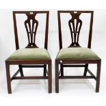 A PAIR OF MAHOGANY GEORGIAN CHAIRS with pierced vase splat backs on square tapering legs, 96cm