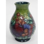 A CONTEMPORARY LATE 20TH CENTURY MOORCROFT BALUSTER VASE decorated in finches and berries, signed to