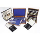 A SELECTION OF BOXED PLATED CUTLERY SETS or canteen sets and a boxed Birmingham silver mounted