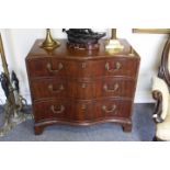 A 19TH CENTURY MAHOGANY SERPENTINE FRONTED CHEST OF THREE LONG DRAWERS with brass handles and