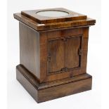AN EARLY VICTORIAN ROSEWOOD PEDESTAL STAND with fielded panel decoration, 38cm x 47cm x 39cm