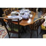 A 19TH CENTURY MAHOGANY AND SATINWOOD CROSSBANDED TILT TOP BREAKFAST TABLE with an octagonal top,