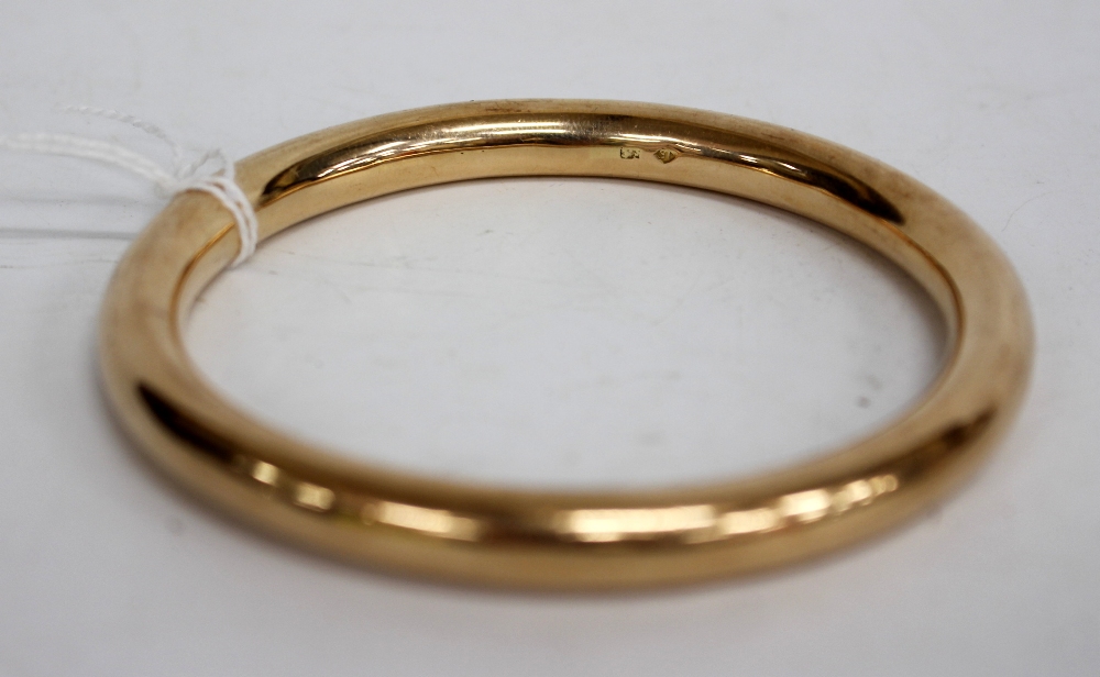 A YELLOW METAL BANGLE marked with 15ct and with inscription to the inside 8cm across - Image 2 of 2