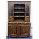 A FRENCH OAK DRESSER the upper section with twin glazed doors flanking open shelves, the base with