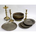 THREE ANTIQUE KNOPPED BRASS CANDLESTICKS, four antique pewter plates and a brass bound bowl (8)