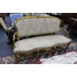 AN ANTIQUE FRENCH GILTWOOD SETTEE with upholstered back and seat and cabriole legs, 165cm wide x