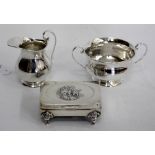 A BIRMINGHAM SILVER TWIN HANDLED BOWL on pedestal base a matching jug, and an antique velvet lined