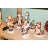 A COLLECTION OF SEVEN GOEBEL FIGURES of children (7)