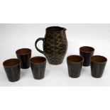 A YELLAND STUDIO POTTERY LEMONADE SET consisting of a jug and six tumblers or cups, all with