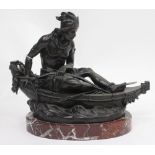 A BRONZE SCULPTURE OF A NATIVE AMERICAN INDIAN in a canoe, mounted on an oval marble base, 38cm wide