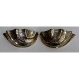 A PAIR OF ENGRAVED SILVER PLATED WALL POCKETS in the shape of shells 24cm across (2)