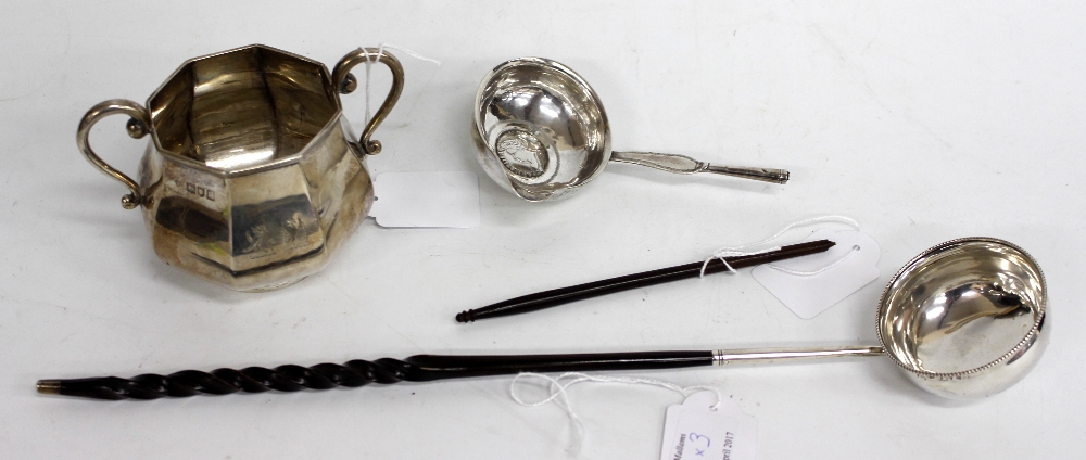 A LONDON OCTAGONAL SILVER SUGAR BASIN and two antique toddy ladles (3)