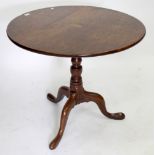 A GEORGIAN OAK TILT TOP TRIPOD TABLE, the circular top 80cm diameter