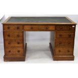 A VICTORIAN OAK PEDESTAL DESK with a leatherette inset top, 138cm wide