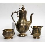 A SILVER COFFEE POT of baluster form, 20cm high together with a matching sugar bowl and cream jug (