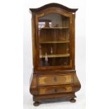 A DUTCH WALNUT DISPLAY CABINET with arching top, with conforming glazed door enclosing velvet