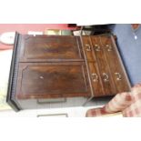 A GEORGIAN MAHOGANY LINEN PRESS with twin panelled doors above two short and two long drawers, all