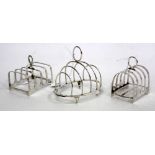 THREE SILVER TOAST RACKS, two of which are a matching pair, the other by Walker and Hall (3)