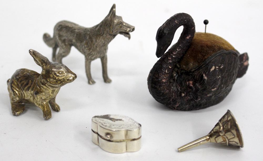 A WHITE METAL PILL BOX, a pin cushion in the form of a swan etc