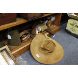 A LEATHER HUNTER'S HAT together with shotgun cartridge belts, two water bottles, further various