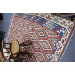 AN EARLY TO MID 20TH CENTURY KELIM PATTERN RUG on a blue and cream ground, 190cm approximately x