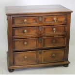 A LATE 17TH CENTURY OAK CHEST OF FOUR FIELDED PANELLED GRADUATED DRAWERS standing on bun feet,