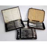 THREE BOXED SETS OF SIX SILVER HANDLED TEA KNIVES (3)