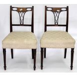 A SET OF FOUR GEORGIAN DINING CHAIRS with line inlaid and fret carved backs, 89cm high (4)