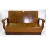 AN ART DECO WALNUT TWO SEATER BENCH with stylised arms, 70cm