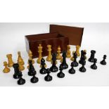 AN OLD STAUNTON PATTERN BOXWOOD AND EBONISED WOOD CHESS SET, the king 9.5cm high and within a