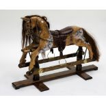 A VINTAGE SMALL SIZED ROCKING HORSE, overall 106cm wide x 75cm in height