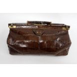A DOCTORS CROCODILE SKIN GLADSTONE NAG with the initials M.P embossed onto the outer case 37cm wide