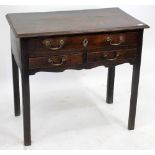 A GEORGE III OAK LOW BOY with one long and two short drawers, standing on square legs, 79cm x 72cm x