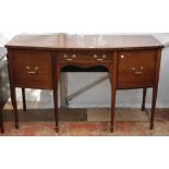 A REGENCY MAHOGANY BOW FRONT SIDE BOARD standing on spade feet, 154cm x 92cm x 61cm