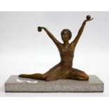 AN ART DECO STYLE SPELTER FIGURE OF A DANCING LADY on a hardstone base, 33cm wide