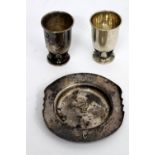 A PAIR OF WHITE METAL SMALL BEAKERS on foliate bases, by Carl Poul Peterson, made for the Emu Wine