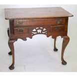 A MID TO LATE 18TH CENTURY OAK LOW BOY fitted with drawers standing on pad feet, 81cm x 68cm x 53cm