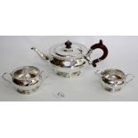 A MAPLE & CO LONDON SILVER TEA SET consisting of a tea pot, cream jug and sucrier with twin